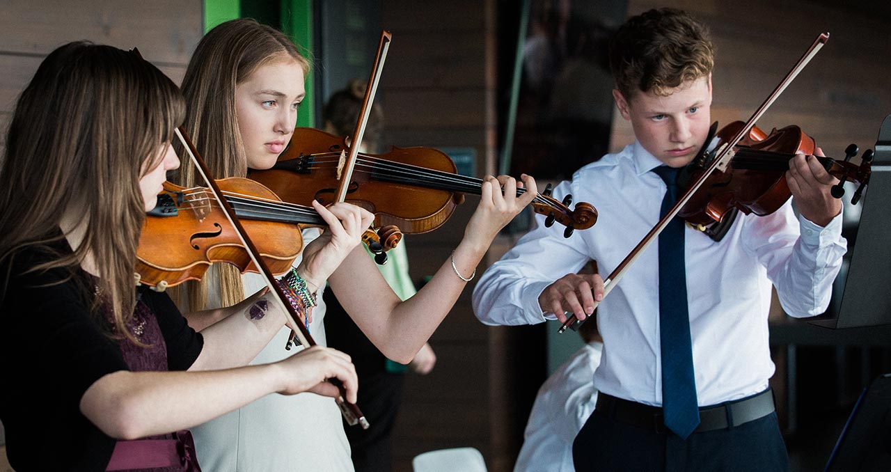 Picture of a student quartet playing the violin