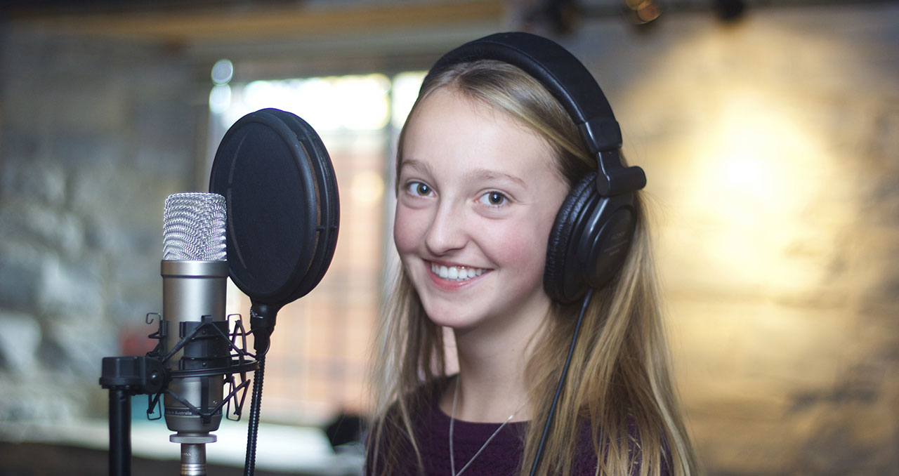 Picture of a student recording a song