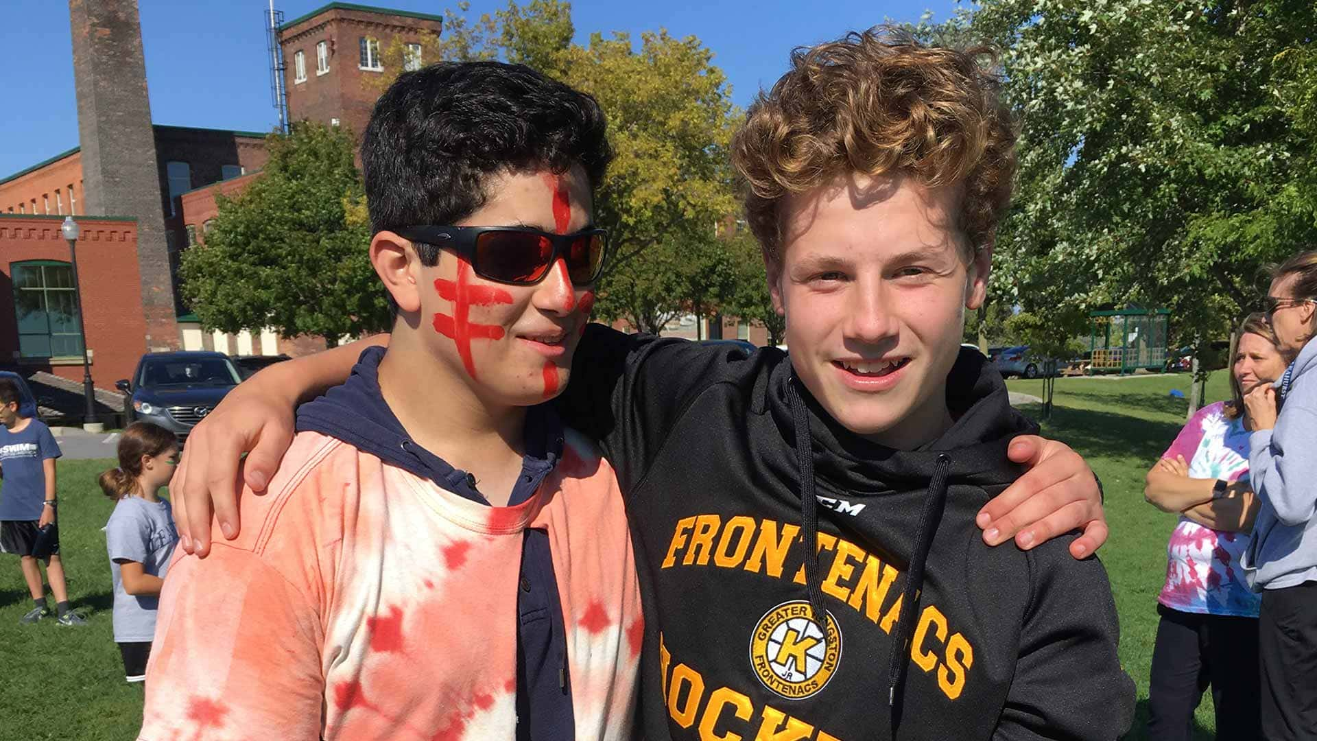 Picture of two students posing for a photo while outdoors