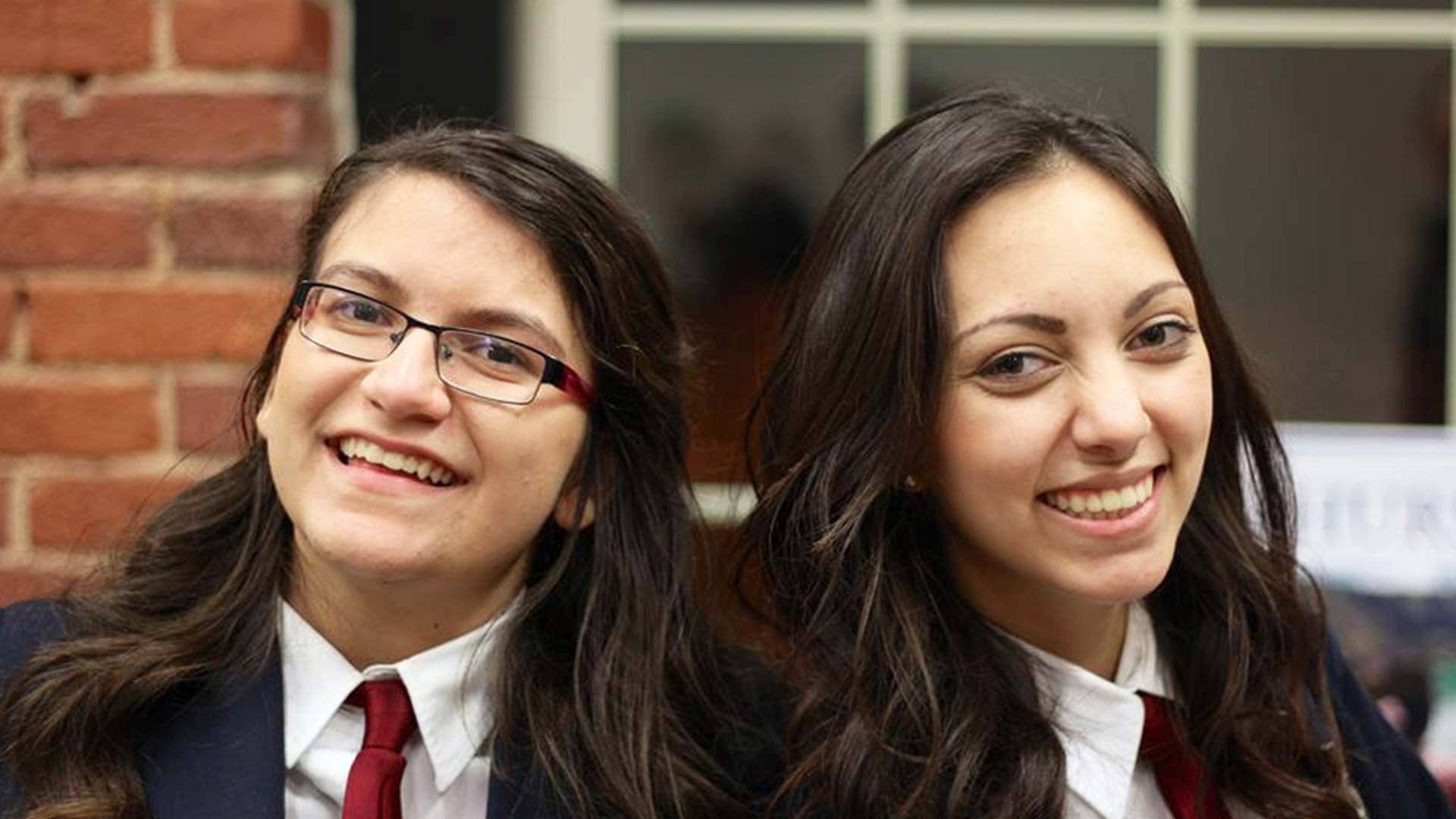 Picture of two students posing for a photo and smiling