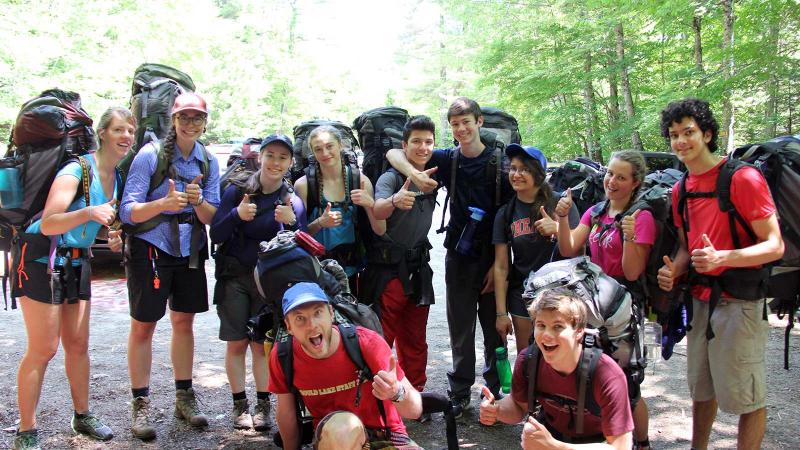 Picture of a group of student campers with their thumbs up