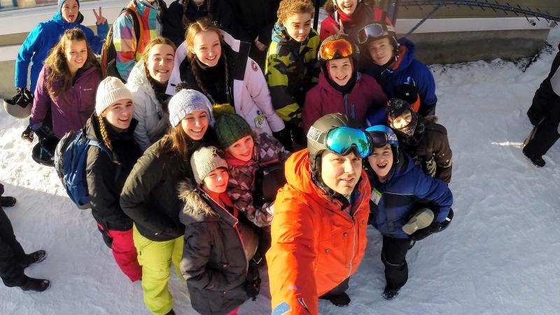 Picture of a group of students and a faculty member at a ski field trip
