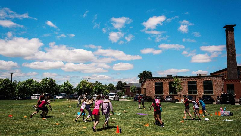 Picture of an outdoor house activity with students