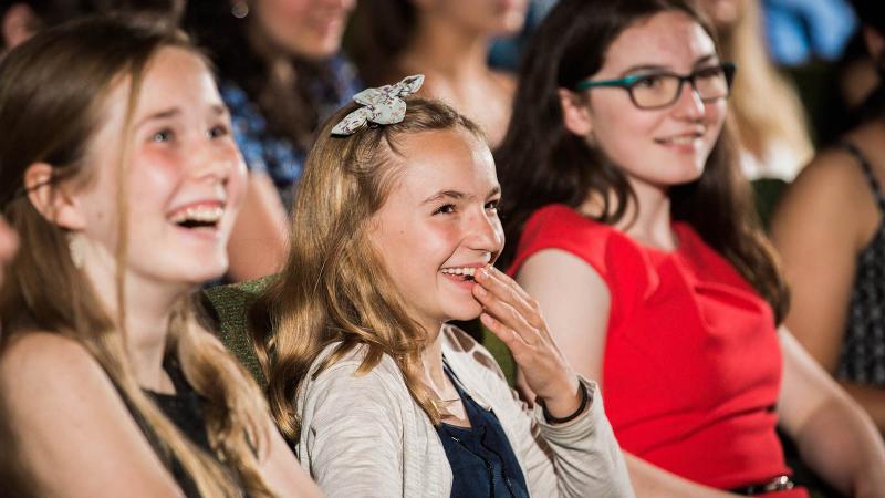 Picture of a student in an seated audience