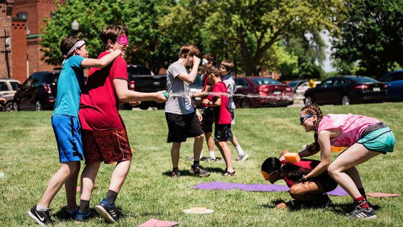 Picture of an outdoor house activity with students