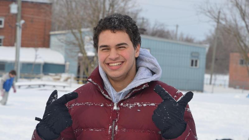 Picture of a student smiling outside in the winter