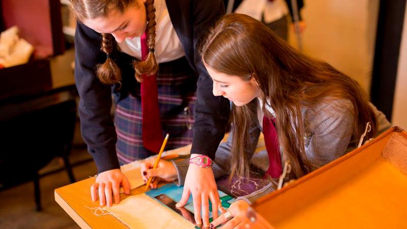 Picture of two students working on a school project together