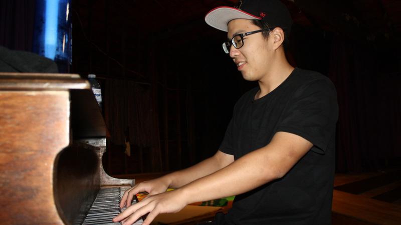 Picture of a student playing the piano