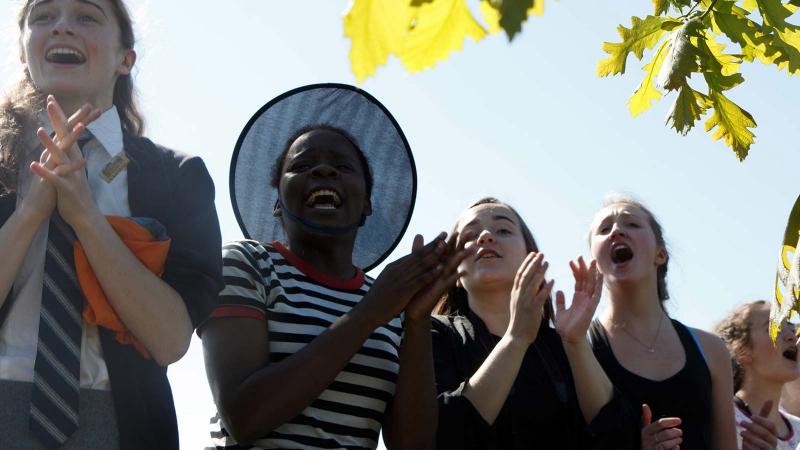 Picture of students cheering outdoors