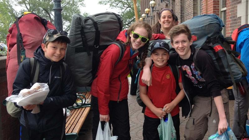 Picture of group of student campers with large camping backpacks