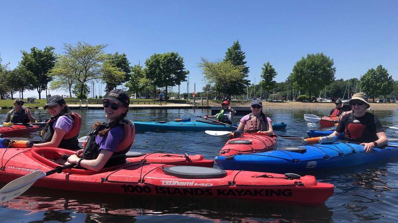 Picture of a group of students in kayaks on a lake