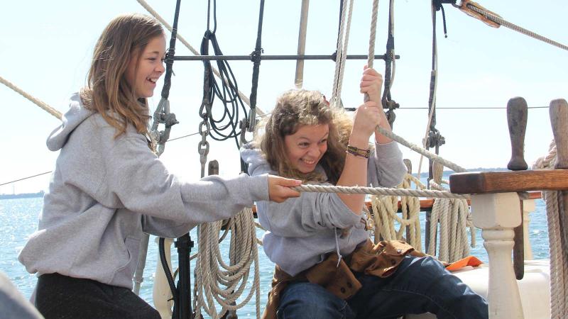 Picture of two students sailing