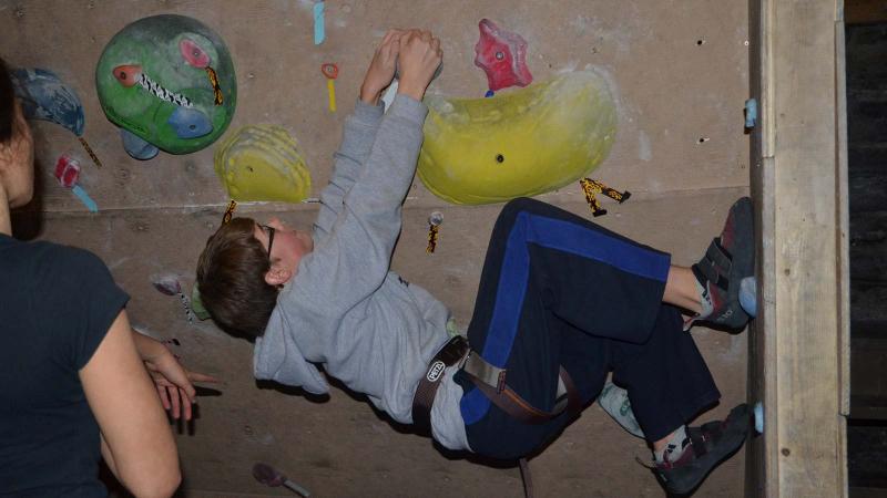 Picture of a student indoor rock climbing