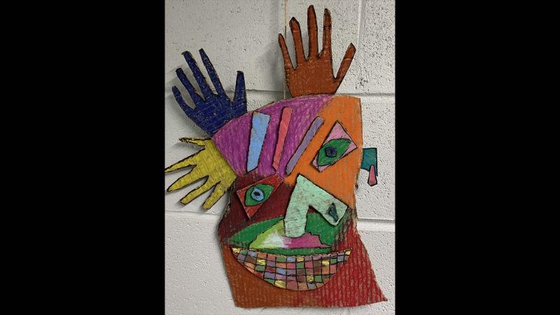 Picture of a student artwork depicting an abstract mask