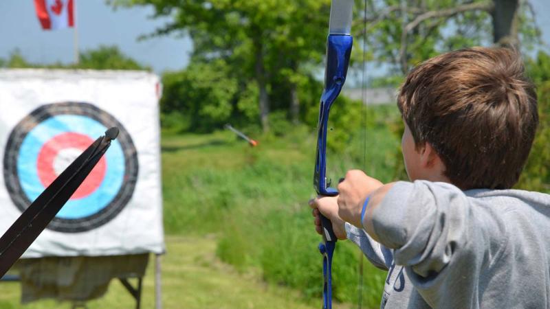 Picture of a student practicing bow and arrow