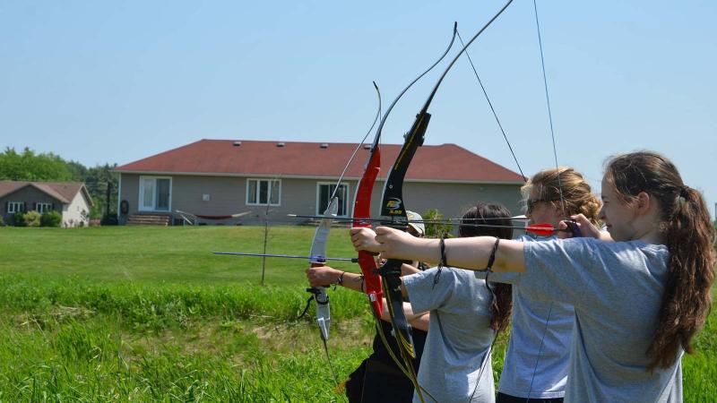 Picture of students practicing bow and arrow