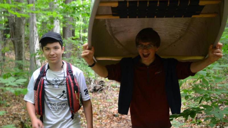 Picture of students with a canoe