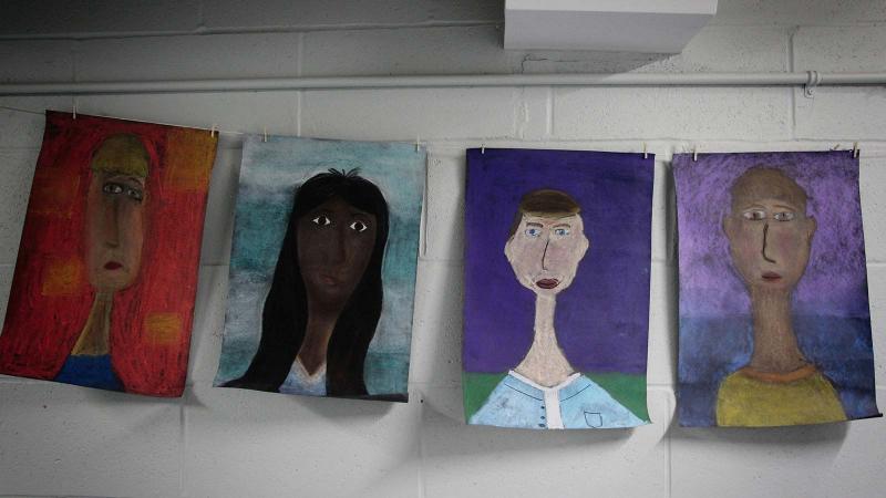 Picture of student artwork hung on a wall
