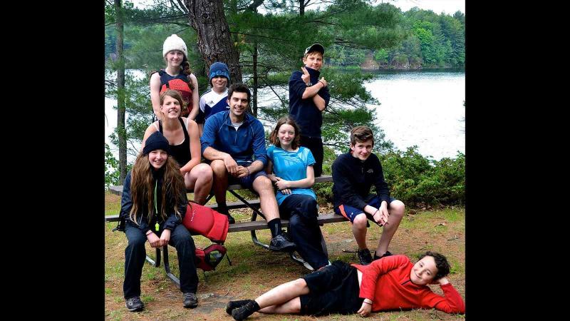 Picture of students sitting on a picnic table