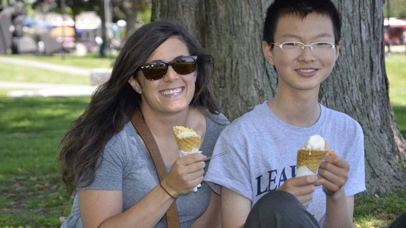 Picture of a teacher with a student eating ice cream