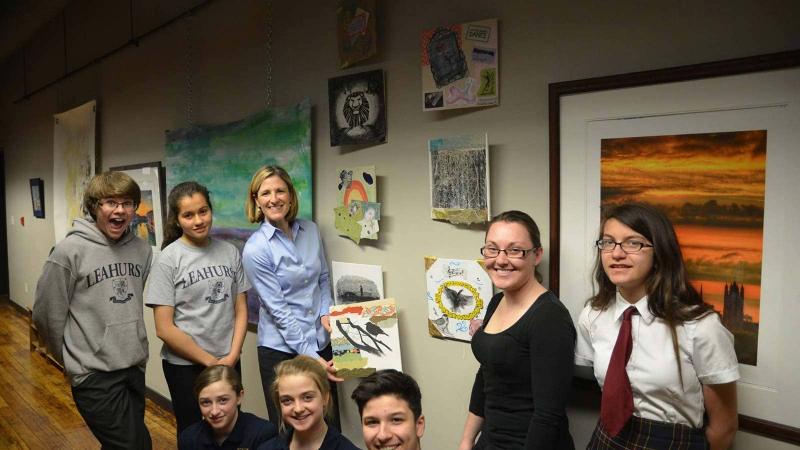 Picture of students in front of artwork