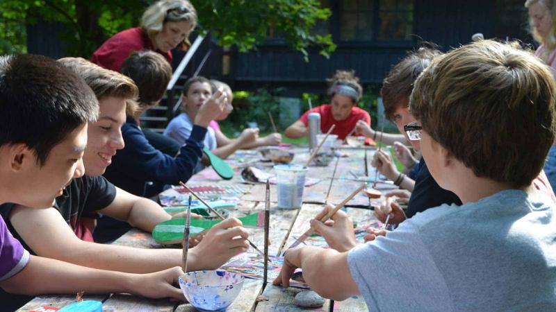 Picture of students making art outdoors